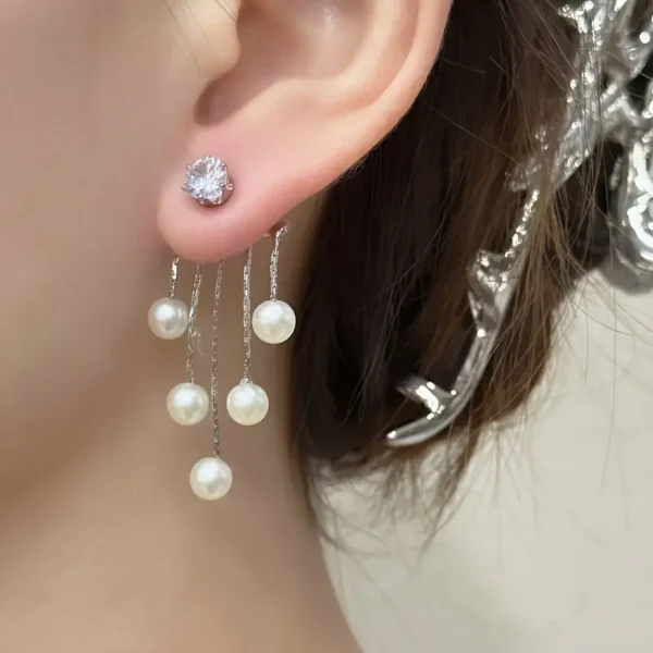 Elegant pearl tassel earrings with a unique retro-inspired design, fashionable vintage-style jewelry for women