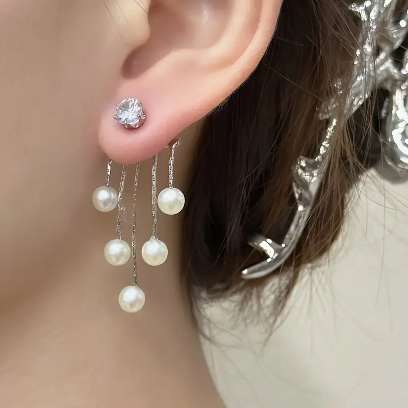 Elegant pearl tassel earrings with a unique retro-inspired design, fashionable vintage-style jewelry for women