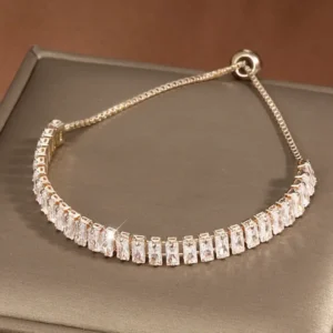 Elegant 18K gold plated copper tennis bracelet for women with synthetic zirconia inlay and adjustable slider design, stylish accessory for daily wear, gifting, or Halloween-themed outfits