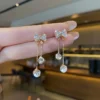 X2A07 - Elegant Gold Butterfly Dangle Earrings for Women – Sparkling Zirconia Accents, Perfect for Weddings & Everyday Glam Look