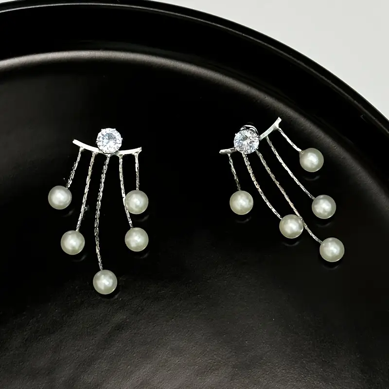 Elegant pearl tassel earrings with a unique retro-inspired design, fashionable vintage-style jewelry for women