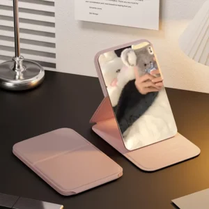 1pc foldable mini pocket makeup mirror with high-definition rectangular glass, faux leather cover, tabletop stand, and cute character design – ideal for travel