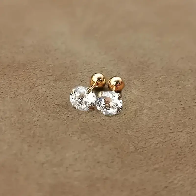 Gold stainless steel four-prong twisted ball earrings with cubic zirconia, simple and stylish design for women's daily wear