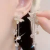 Elegant gold butterfly dangle earrings with sparkling zirconia accents, stylish jewelry for weddings and everyday glamour